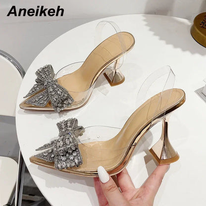 Aneikeh 2026 Fashion Crystal Sequined Bowknot Women Pumps Sexy Pointed Toe High Heels PVC Transparent Sandals Wedding Prom Shoes