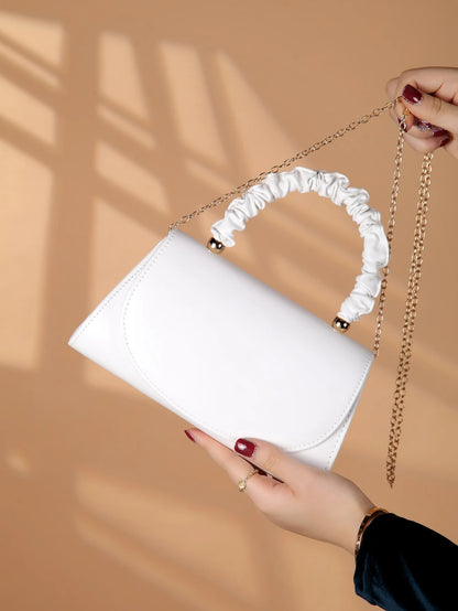 Elegant light luxury solid color women's handbag, fashionable and romantic banquet clutch, suitable for women's daily use..